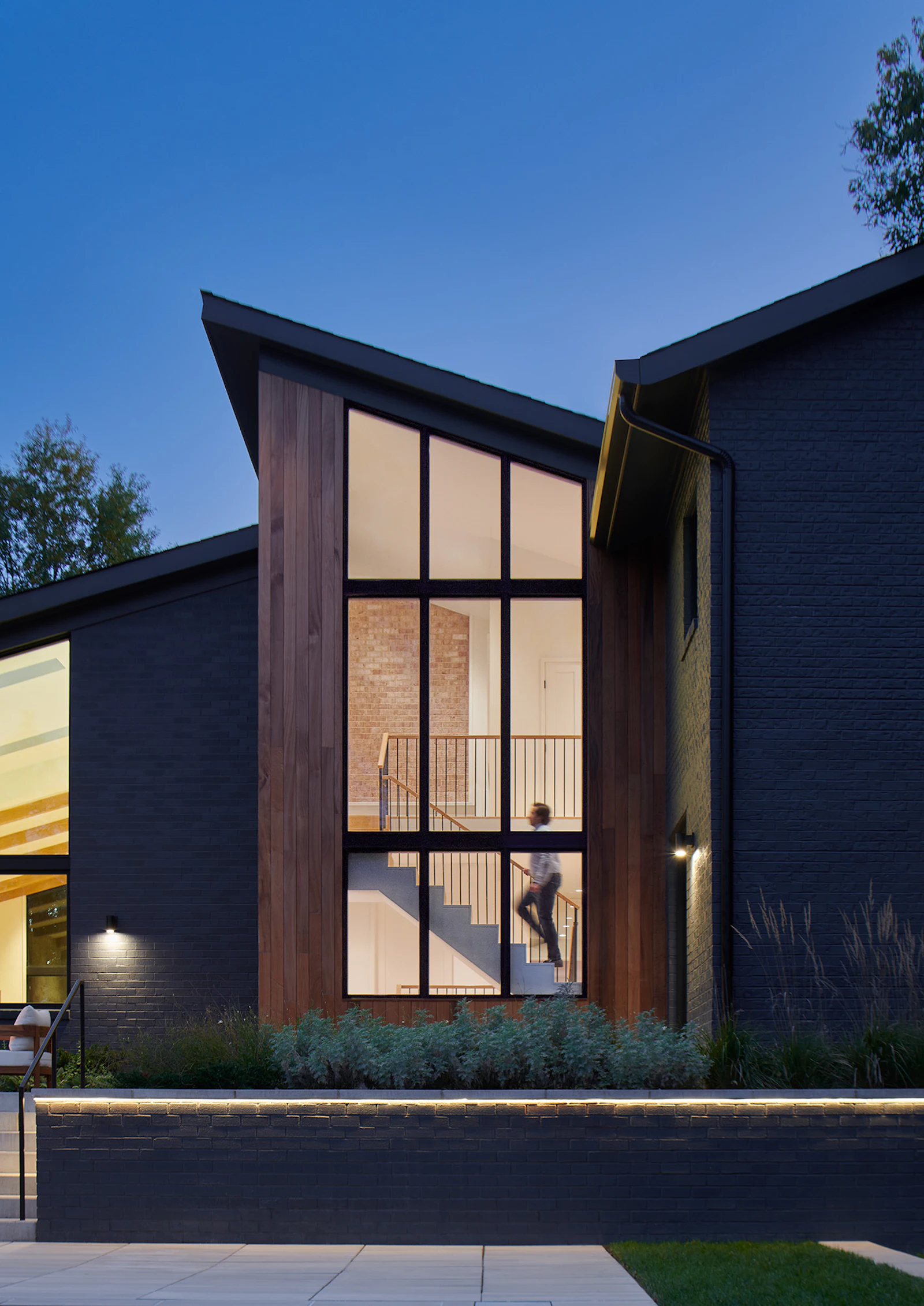 Central portions of the rear facade following renovation, including a new staircase