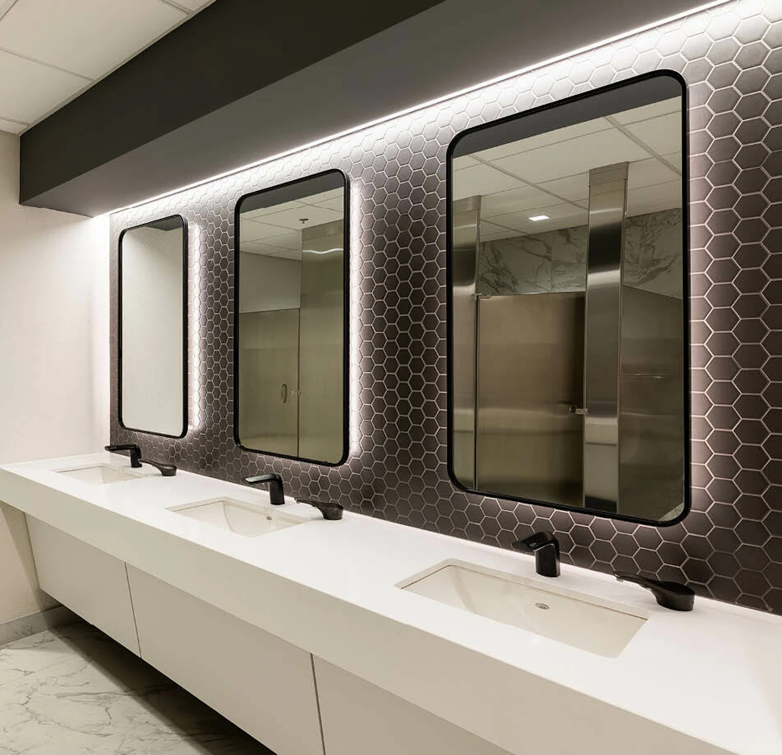 Spec suite restrooms include sleek modern finishes. 