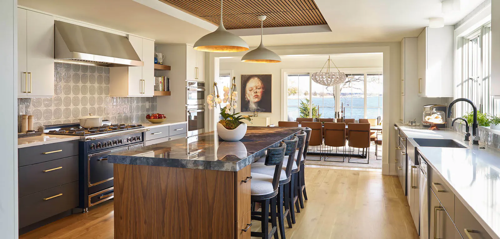 A reconfigured kitchen and dining room provides ample working space and waterfront views. 