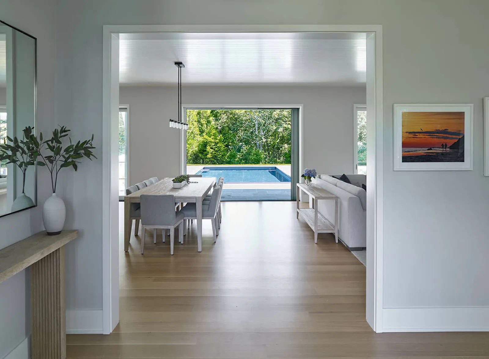 The home centers stunning views to the outdoors and a small mudroom with built-in shelving and cabinetry. 