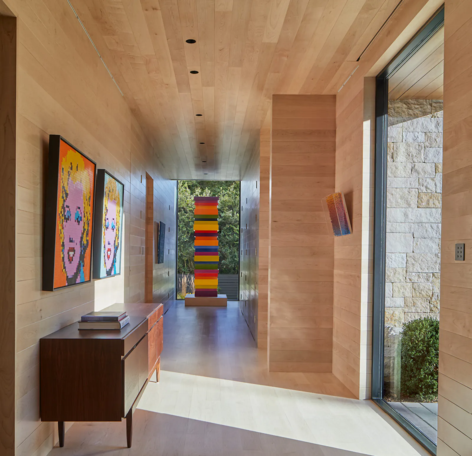 A maple-enclosed corridor serves as a rotating gallery. 