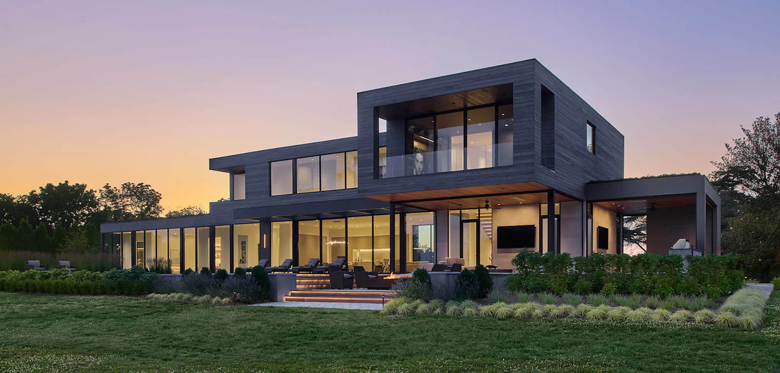 The rear facade of a modern building at dusk 