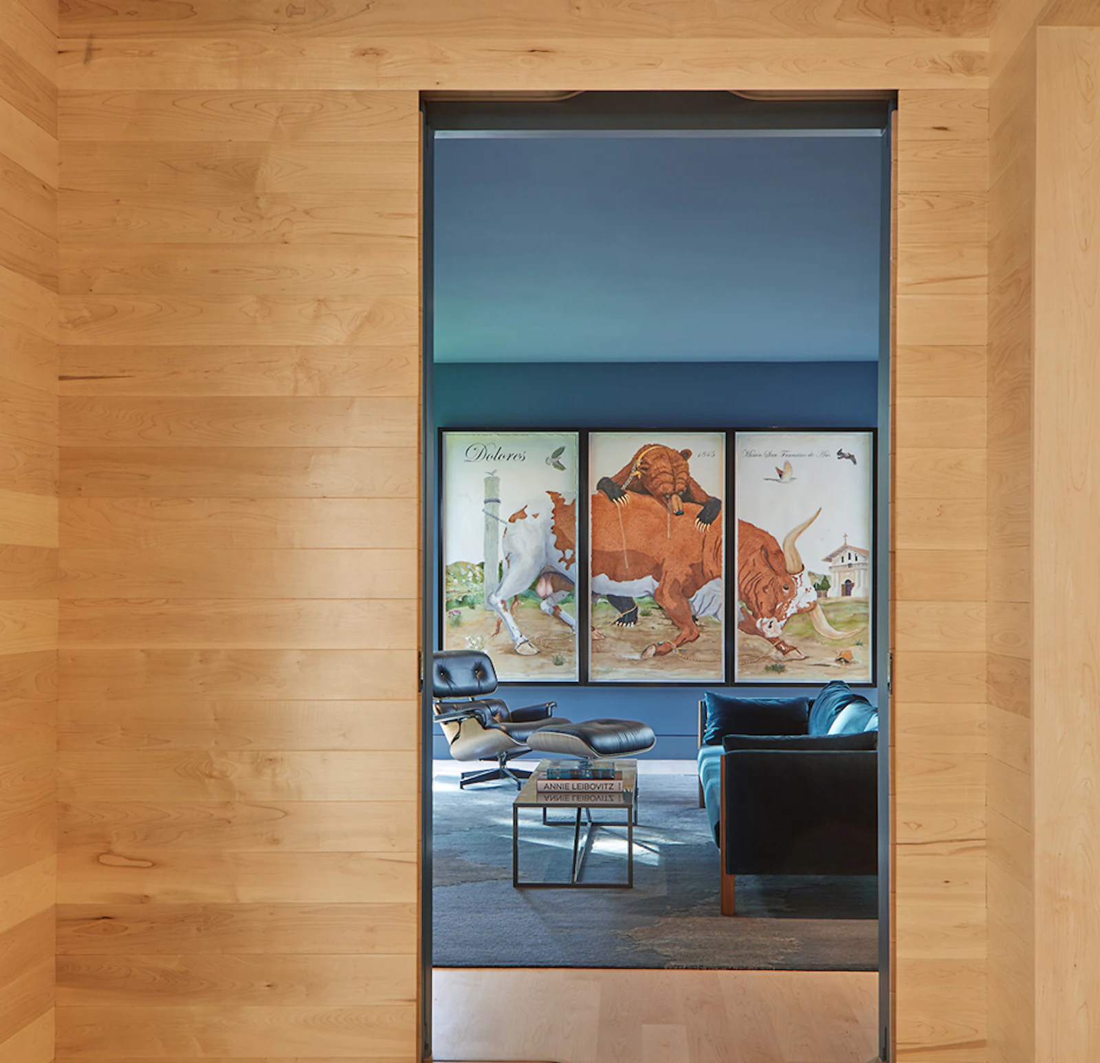 Doorways are integrated into the maple, maintaining visual calm. 